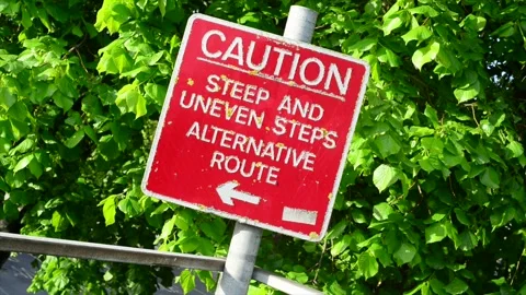Caution warning sign of steep and uneven steps selby united kingdom Stock Footage 171322389