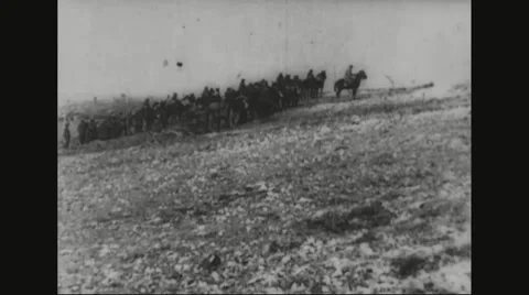 Cavalry moving on barren land Stock Footage