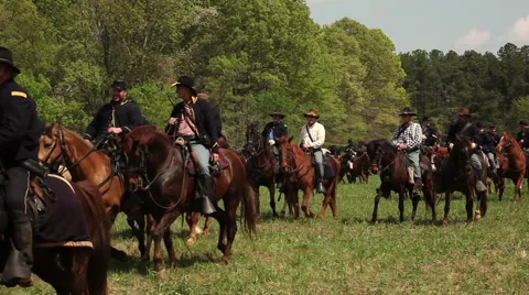 Cavalry riders in procession pass by, Civil War scenes Stock Footage 39982166