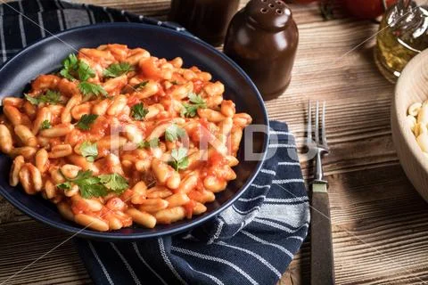 Cavatelli pasta with fresh tomato sauce. Stock Photos