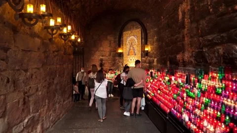 Cave adit of the monastery with a platform for candles Stock Footage 172391964