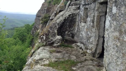 Cave and mountains and clouds and a tree at Mangup Kale - Crimea , Russia Stock Footage 73766054