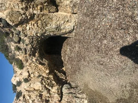 Cave at the beach Stock Photos
