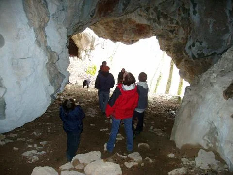 A cave is a cavity within the rock Stock Photos