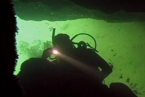 Cave Diver With Flashlight Enters Underwater Cave Swim To Camera Scuba Diving  Stock Footage 142408