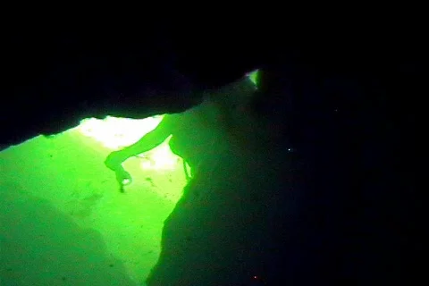 Cave Diver With Flashlight Exploring an Underwater Cave Scuba Diving Stock Footage 141111