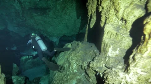 Cave Diver Passing Large Limestone Column 스톡 동영상 341360198