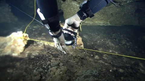 Cave diver working with reel Stock Footage 83102351