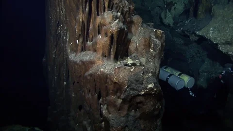 Cave divers exploring underwater cave system Stock Footage 83102458