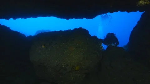 Cave diving scuba divers exploring caves underwater discovery Stock Footage 104163690