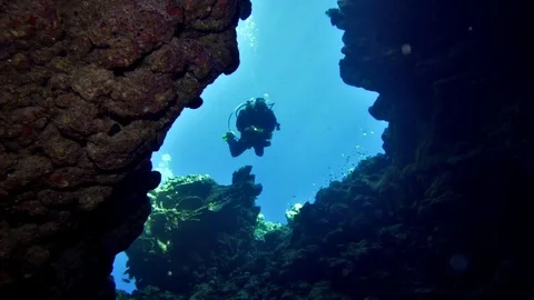 Cave diving underwater scuba divers exploring cave dive Stock Footage 84947896