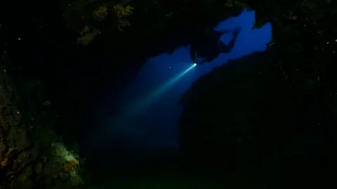 Cave diving underwater scuba divers exploring caves Stock Footage 330965442