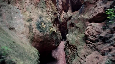 Cave exploration young explorer walks through a narrow cavern exploring 스톡 동영상 178930566