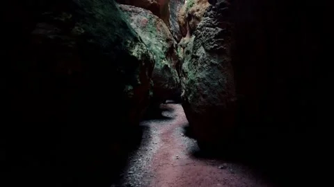 Cave exploration young explorer walks through a narrow cavern exploring Vídeo Stock 178930568