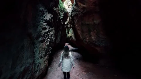 Cave exploration young explorer walks through a narrow cavern exploring Vídeo Stock 178934678
