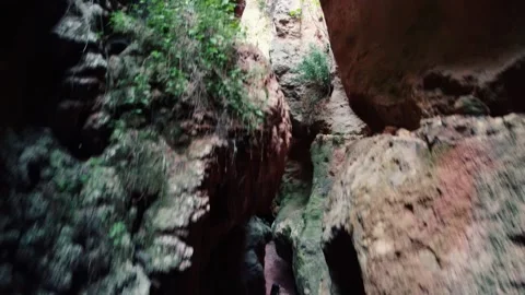 Cave exploration young explorer walks through a narrow cavern exploring Vídeo Stock 178935487