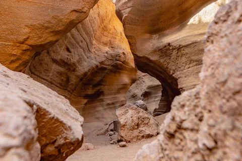 A cave with a hole in the middle Stock Photos