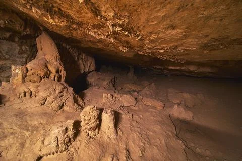 Cave Interior with Rugged Rock Formations and Light Painting in Cowboy Cany.. Stock Photos