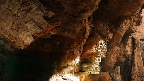 Cave interior showing rock formations and lighting in a natural setting Stock Footage 342804250