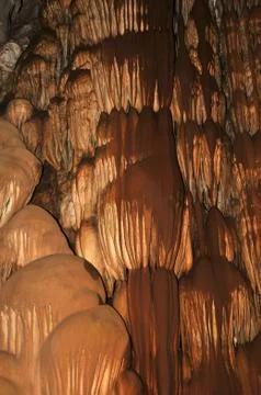 Cave interior with water dripping down the wall that looks like chocolate. ph Stock Photos