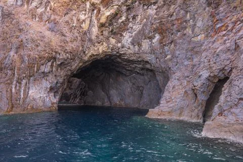 Cave on the island Stock Photos