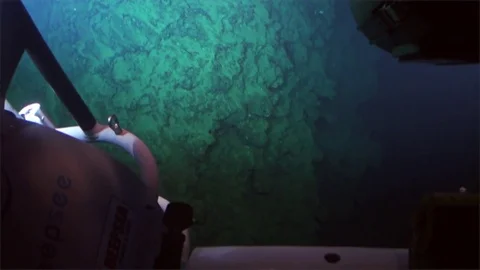 Cave, reefs, coral, deep sea view from submarine in 300 m depth - Pacific Ocean. Stock Footage