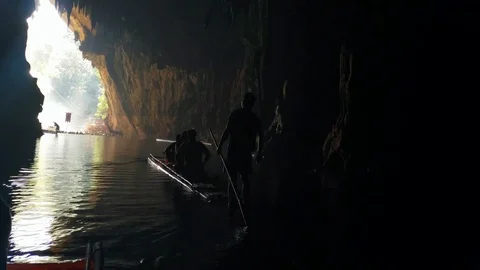 Cave, UHD handheld view of people floating through a the tham lod cave, in Pa Stock Footage 83367735