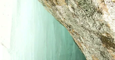 Cave underneath small icefall Stock Footage 49086098