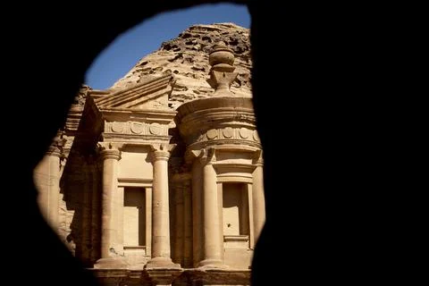 Cave view on the Monastery (ad deir) in Petra, Jordan. Stock Photos