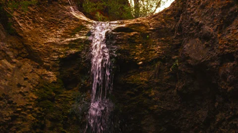 Cave waterfall medium shot 4K Stock Footage 33721925