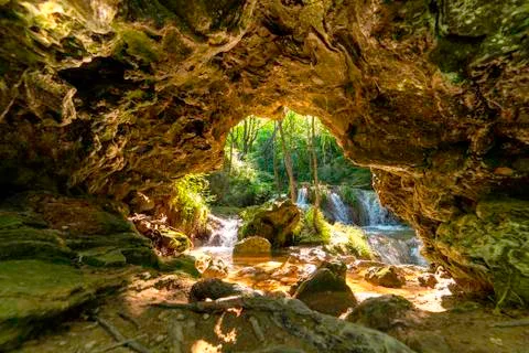 Cave with waterfall Stock Photos