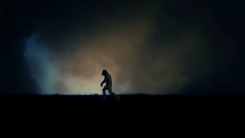 A Caveman Walking in Empty Field Under a Storm Stock Footage 103598735