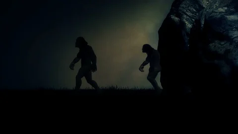 Cavemen Stepping Out of their Cave Under a Storm Stock Footage 103597090