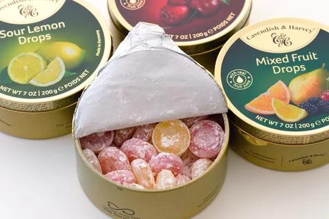 Cavendish &amp; Harvey tin boxes with fruit drop candies. One box is open Stock Photos