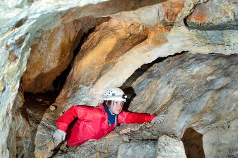 Caver exploring the cave Stock Photos