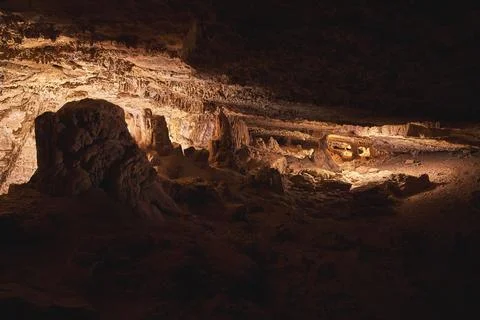 Cavern Interior with Rock Formations and Dramatic Light Painting in Cowboy .. 스톡 사진