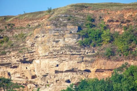 Caves in the cliff Stock Photos