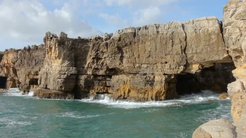 Caves into cliff rocks, Devils Mouth, Lisbon, Portugal Stock Footage 78136773