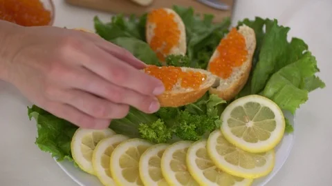 Caviar bread on plate CU Stock Footage 77358960