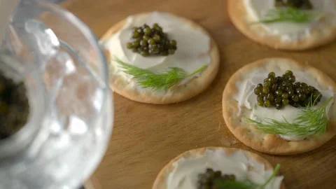 Caviar on cracker with cream cheese Stock Footage 234445906