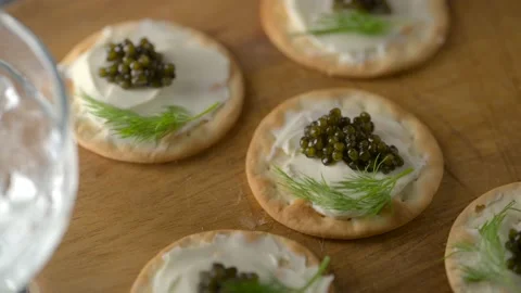 Caviar on cracker with cream cheese Stock Footage 234446378