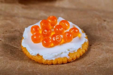 Caviar on the cracker. red caviar on a bread slice Stock Photos