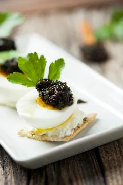 Caviar, egg and crispy bread Stock Photos