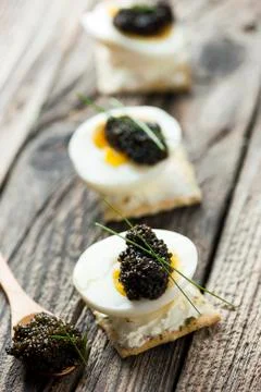 Caviar, egg and crispy bread Stock Photos
