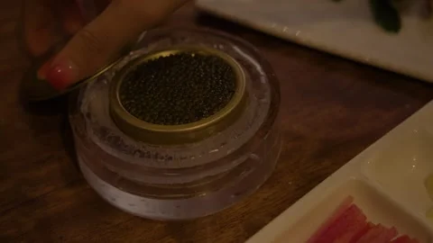 Caviar Tin Being Opened and Served on Ice at Restaurant Table in Beijing, China Stock Footage 345762980