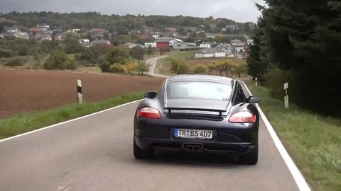 Cayman driving on the road. Video stock 69231797
