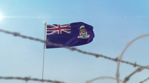 Cayman Islands  flag behind border Stock Footage 137402664