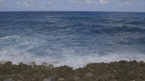 Cayman Islands Ocean Waves Roll In To Rocky Beach 스톡 동영상 124484718