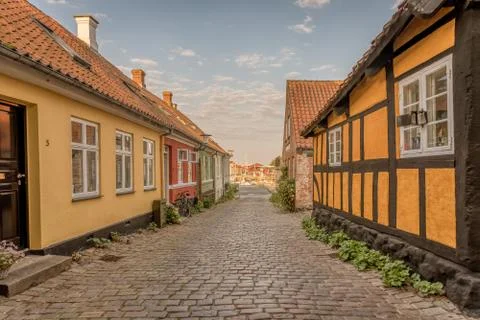 A cbblestone lane down to the harbour of Faaborg Stock Photos