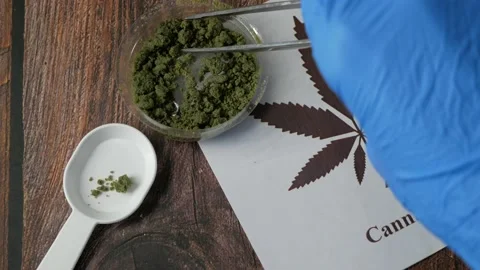 CBD Hemp pills and extract. Cannabis drugs, marijuana buds and dry grass. C.. Stock Footage 225288313